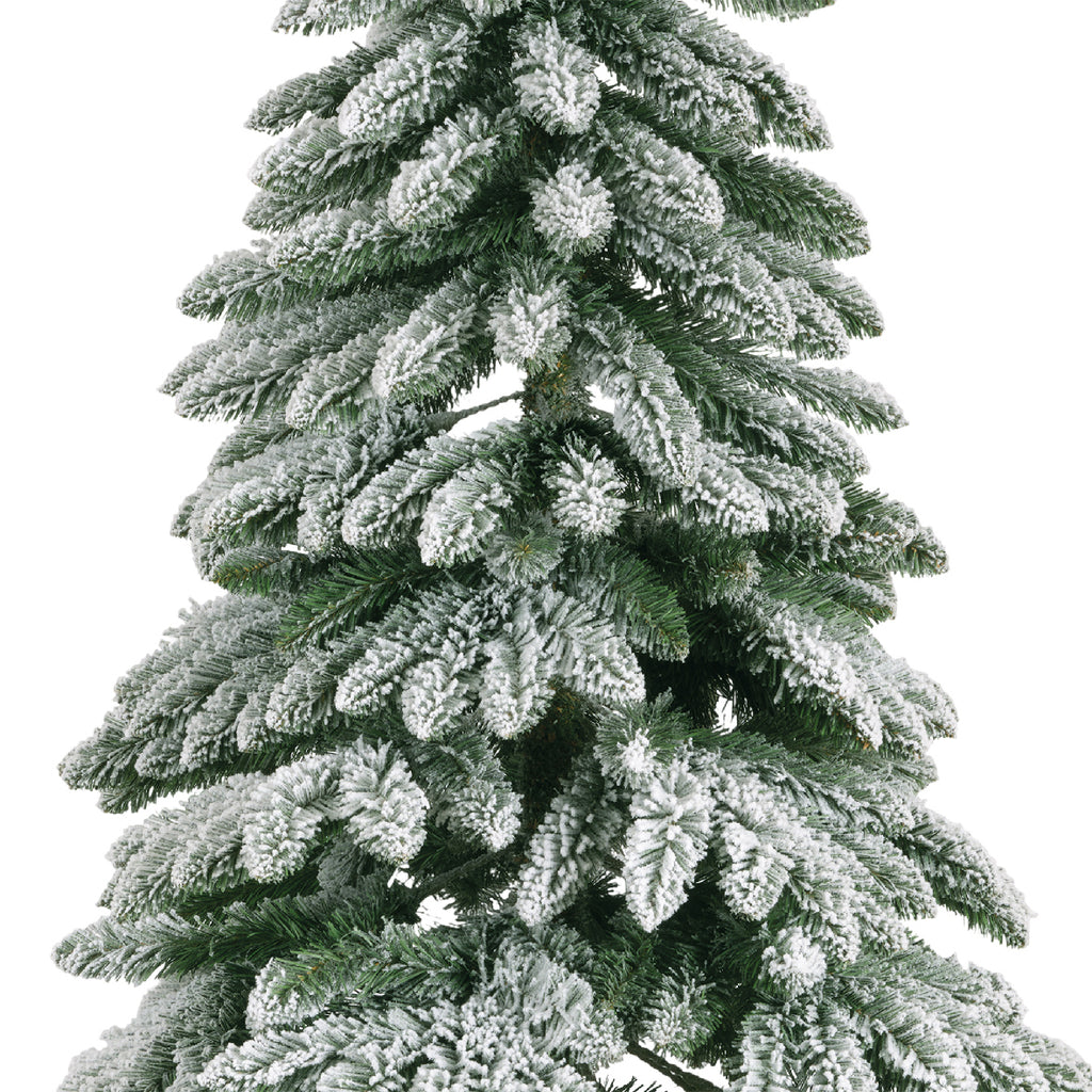 Snow‑tipped Tora Pine artificial Christmas tree (6 -7ft), realistic PVC needles with snowy finish, perfect for festive décor.