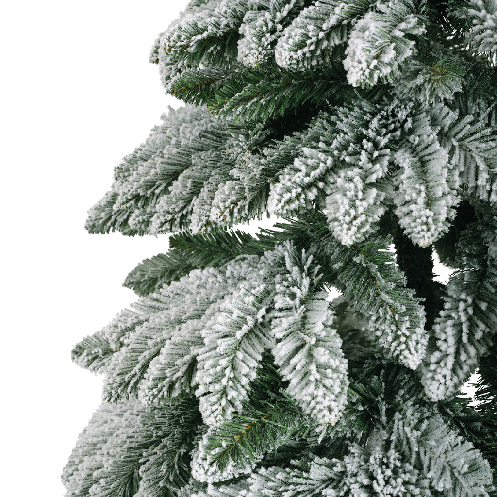 Snow‑tipped Tora Pine artificial Christmas tree (6 -7ft), realistic PVC needles with snowy finish, perfect for festive décor.