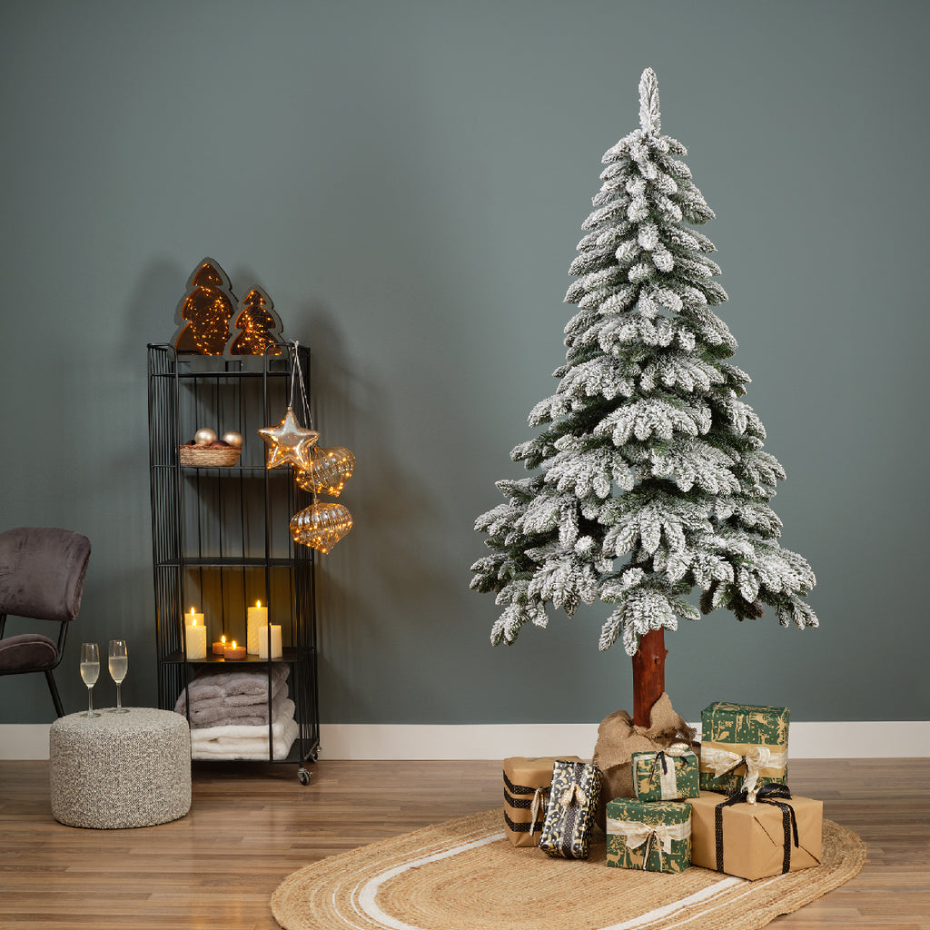 Snow‑tipped Tora Pine artificial Christmas tree (6 -7ft), realistic PVC needles with snowy finish, perfect for festive décor.
