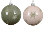 Two Christmas ornaments with snowflake designs on a white background