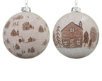Two Christmas ornaments with cabin designs on a white background