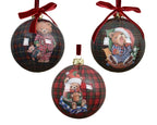 Three Christmas ornaments with teddy bears on plaid backgrounds, each tied with a red ribbon.