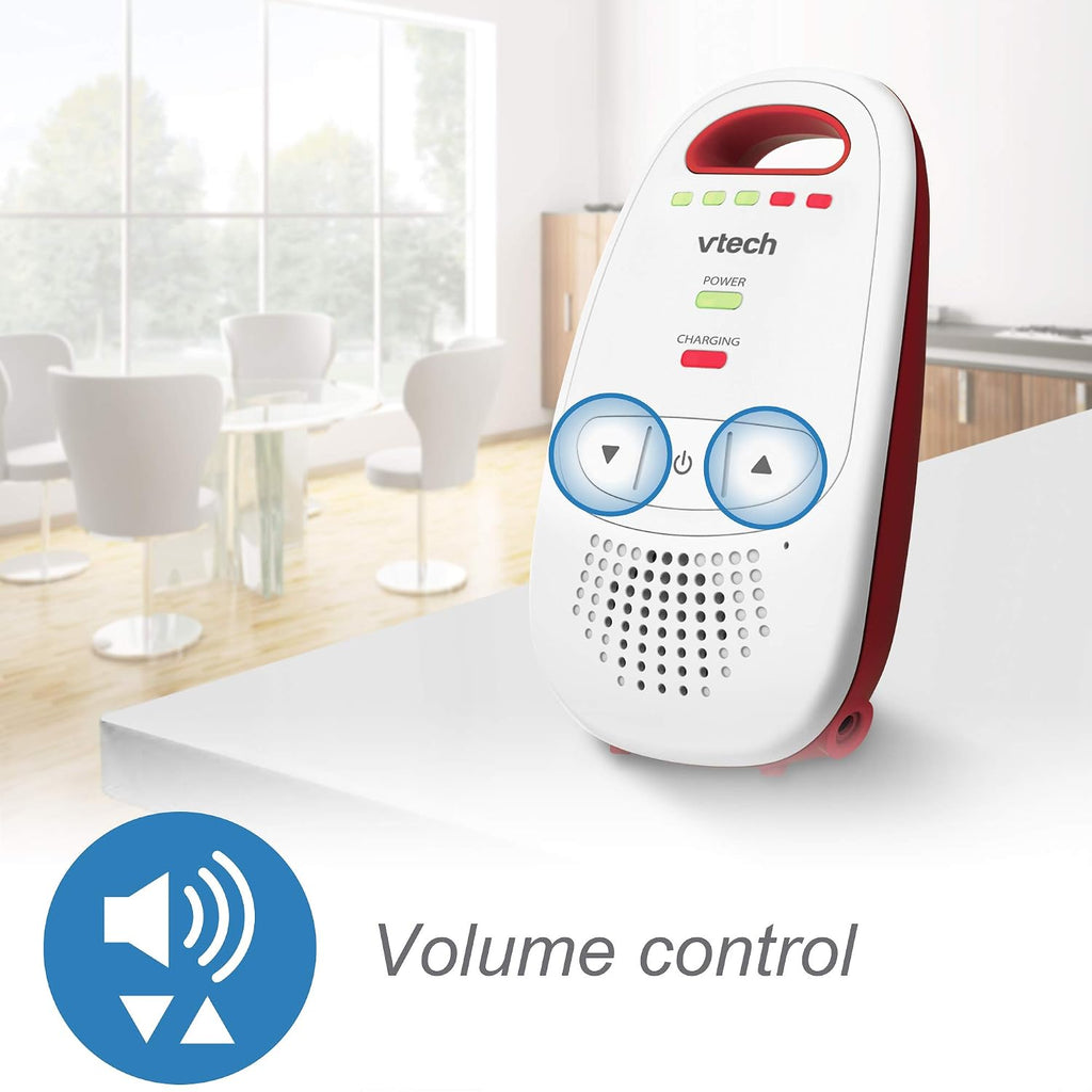 A white and red Vtech portable baby monitor with blue volume control buttons, shown on a white table with a blurred office background and a 'Volume control' graphic overlay.