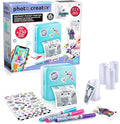 Photo Creator instant pocket printer with packaging, printer, ink cartridges, and printed photos on a white background.