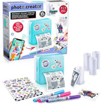 Photo Creator instant pocket printer with packaging, printer, ink cartridges, and printed photos on a white background.