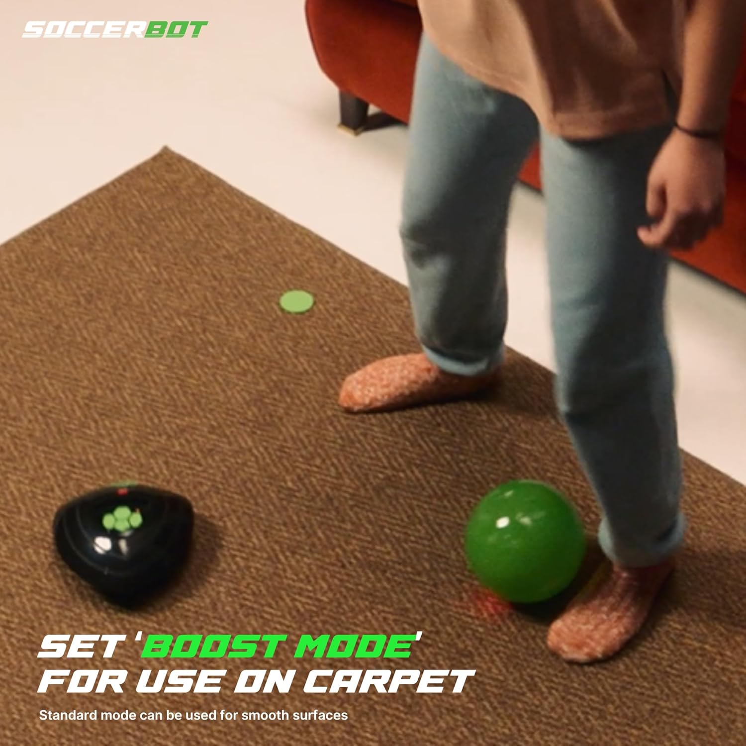 Person playing with a green ball on a carpet, with text about using 'Boost Mode' for carpet use.
