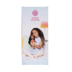 Product packaging for a doll with a girl holding it, featuring a brand logo on a white background.