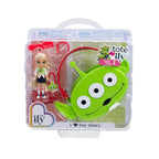 Toy Story-themed product with green alien character and doll in packaging