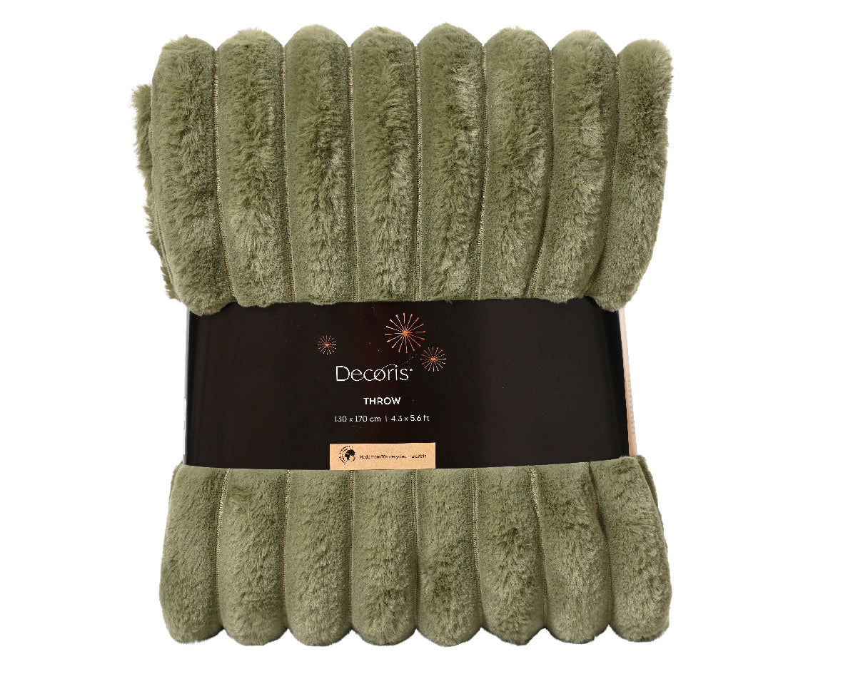 Green throw blanket with Decors label on a white background