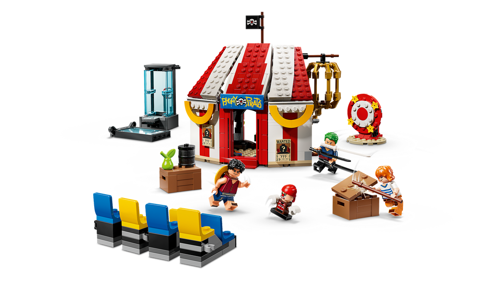 LEGO set with a circus-themed building, performers, and audience chairs on a white background