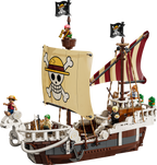 Pirate ship model made of building blocks with a skull and crossbones flag on a white background