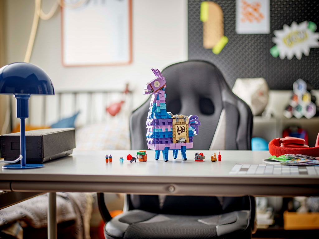 Colorful toy figure on a desk with a chair and lamp in a room setting
