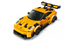 Yellow toy sports car with black details on a white background