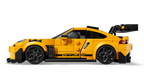Yellow sports car model made of interlocking bricks on a white background
