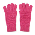 A pair of bright pink cable-knit gloves with ribbed cuffs, displayed flat against a white background.