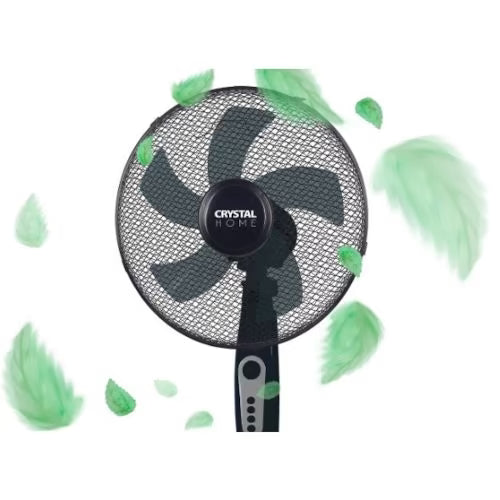 A black Crystal Home pedestal fan shown against a white background with floating green leaf and feather graphics.