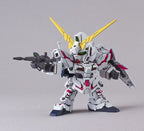 Model robot toy with white, gray, and yellow color scheme on a gray background