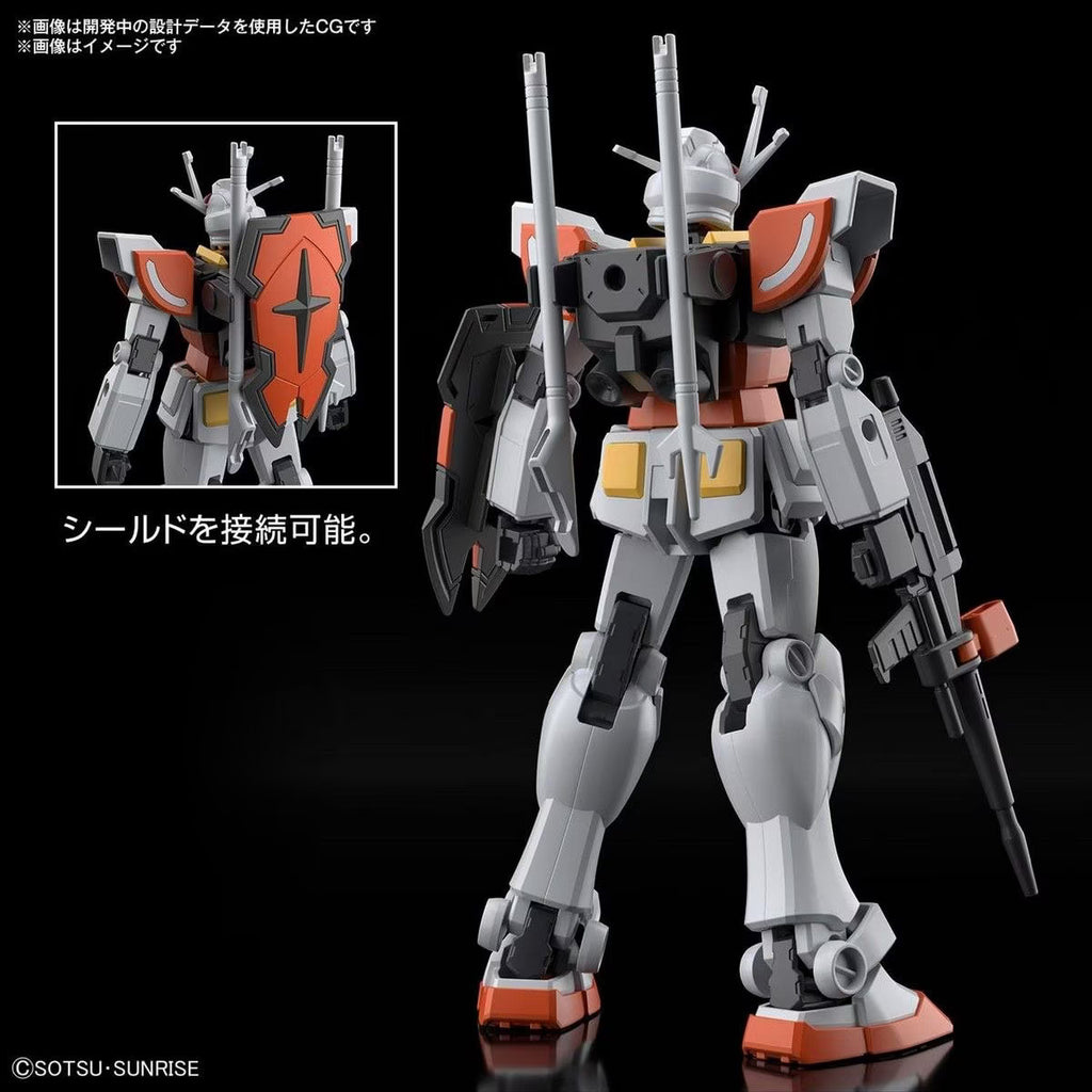 Model kit of a robot with orange and gray color scheme on a black background