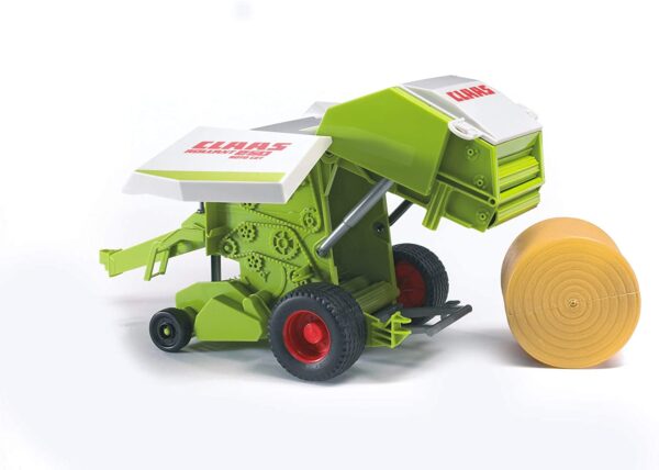 A Bruder Claas Round Baler toy, featuring a green and gray baler with a bale of hay attached, and red and black wheels and accents.