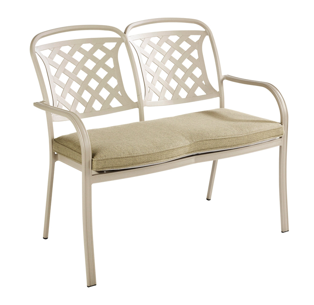 A two-seat outdoor patio bench with a cream-colored metal frame featuring lattice backrests and curved armrests, fitted with a maize wheat beige cushioned seat pad, shown on a plain white background.