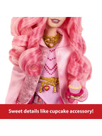 Doll with pink hair and outfit holding a cupcake accessory on a white background