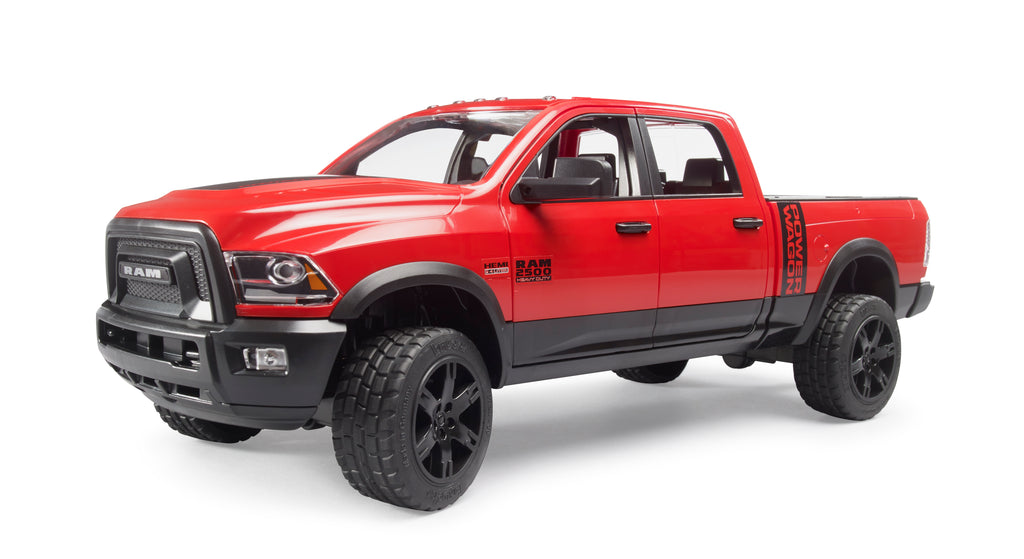 Side view of a red Bruder RAM 2500 power wagon