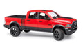 A red RAM 2500 Power Wagon toy truck with four doors, a steering wheel, and black wheels, designed at a 1:16 scale.