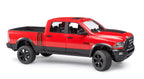 A red RAM 2500 Power Wagon toy truck with four doors, a steering wheel, and black wheels, designed at a 1:16 scale.