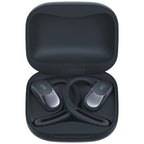 Black wireless earbuds in a matching case on a white background