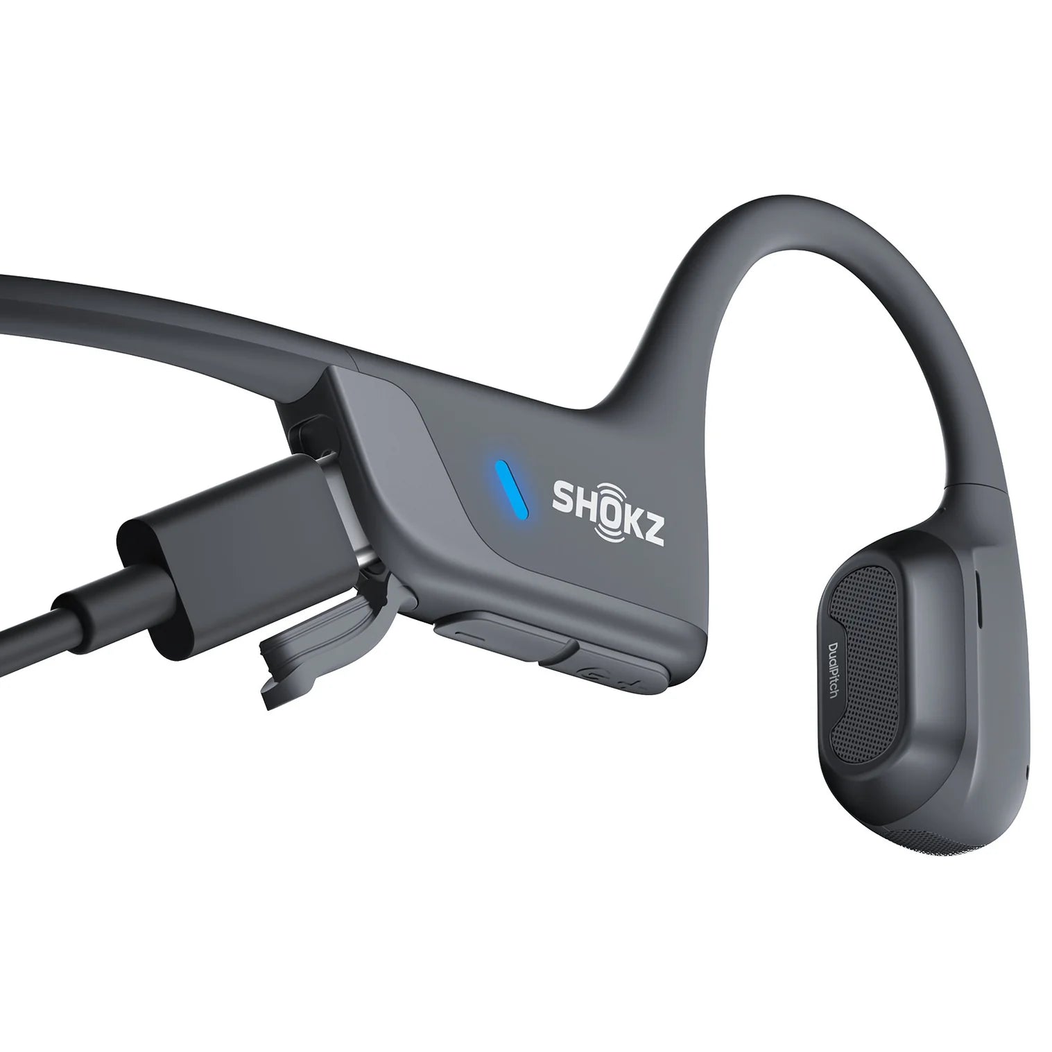 Shokz bone conduction headphones connecting through usb on a white background