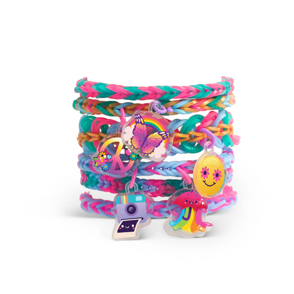 Colorful braided bracelets with various charms on a white background