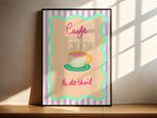 Framed artwork with a coffee cup illustration and text on a striped background