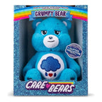 Blue plush bear toy in a glittery box with 'Care Bears' branding
