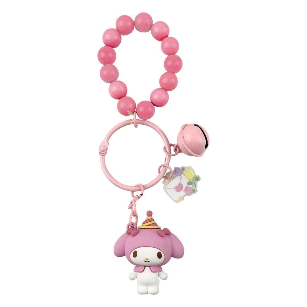 Pink keychain with a cartoon character and colorful charm on a white background