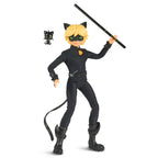 Toy figure of a character in a black outfit with a mask, holding a weapon on a white background