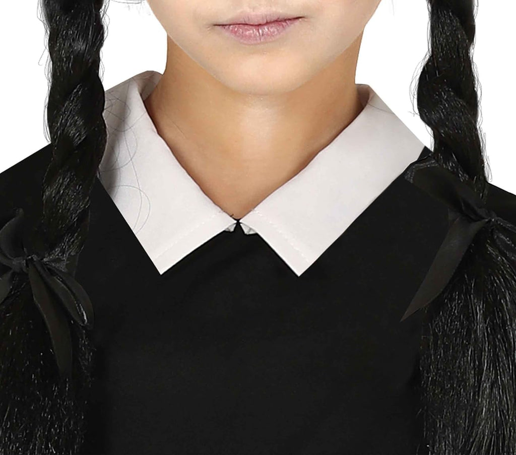 Person wearing a black outfit with a white collar, likely a costume.