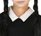 Person wearing a black outfit with a white collar, likely a costume.