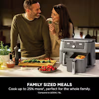 A countertop air fryer in gray and black is shown in a kitchen setting with a man and woman standing behind it, with the text 'FAMILY SIZED MEALS' at the bottom.