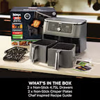 Ninja food processor with its accessories and packaging displayed on a kitchen counter, featuring a black and gray processor, three clear containers, and a Ninja-branded box. A text overlay at the bottom reads 'WHAT'S IN THE BOX'.
