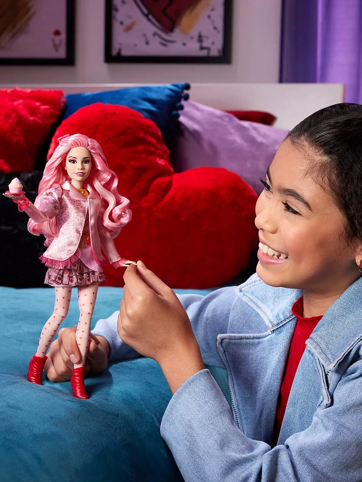 Child playing with a doll in a bedroom setting