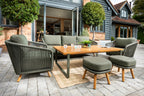 Eden 3 Seat Lounge Outdoor patio set with wooden table and green chairs in front of a house.