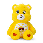 Yellow plush bear toy with a smiling face and heart details on a white background