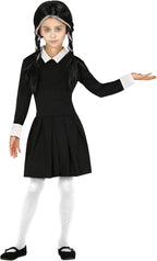 Child wearing a black and white costume with a dress and pigtails on a white background