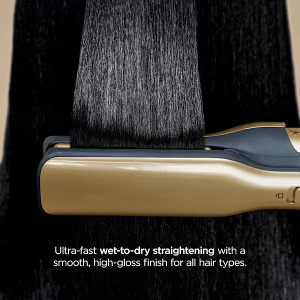 Hair straightening tool with black hair being styled against a dark background