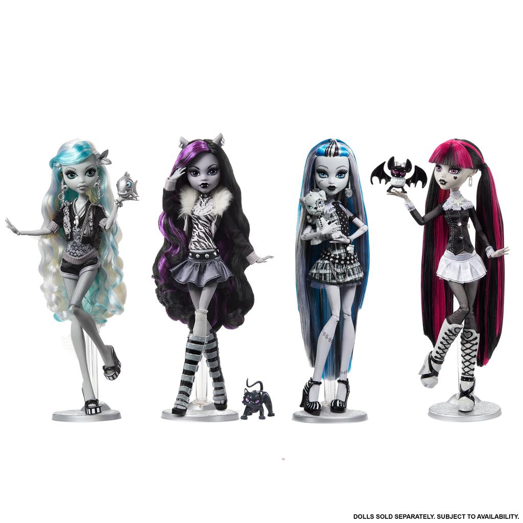 Four Monster High dolls with distinct hairstyles and outfits on a white background