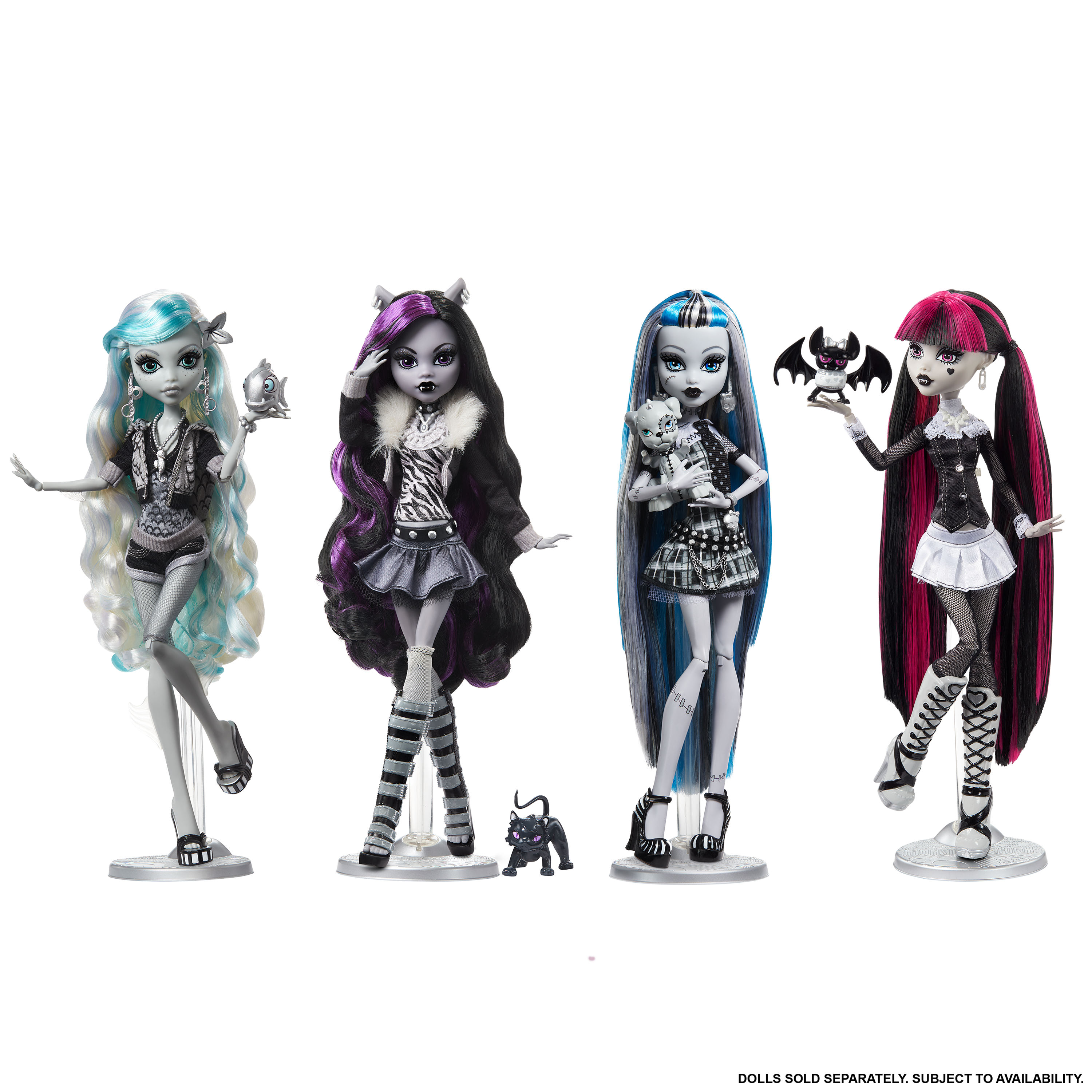 Four Monster High dolls with distinct hairstyles and outfits on a white background