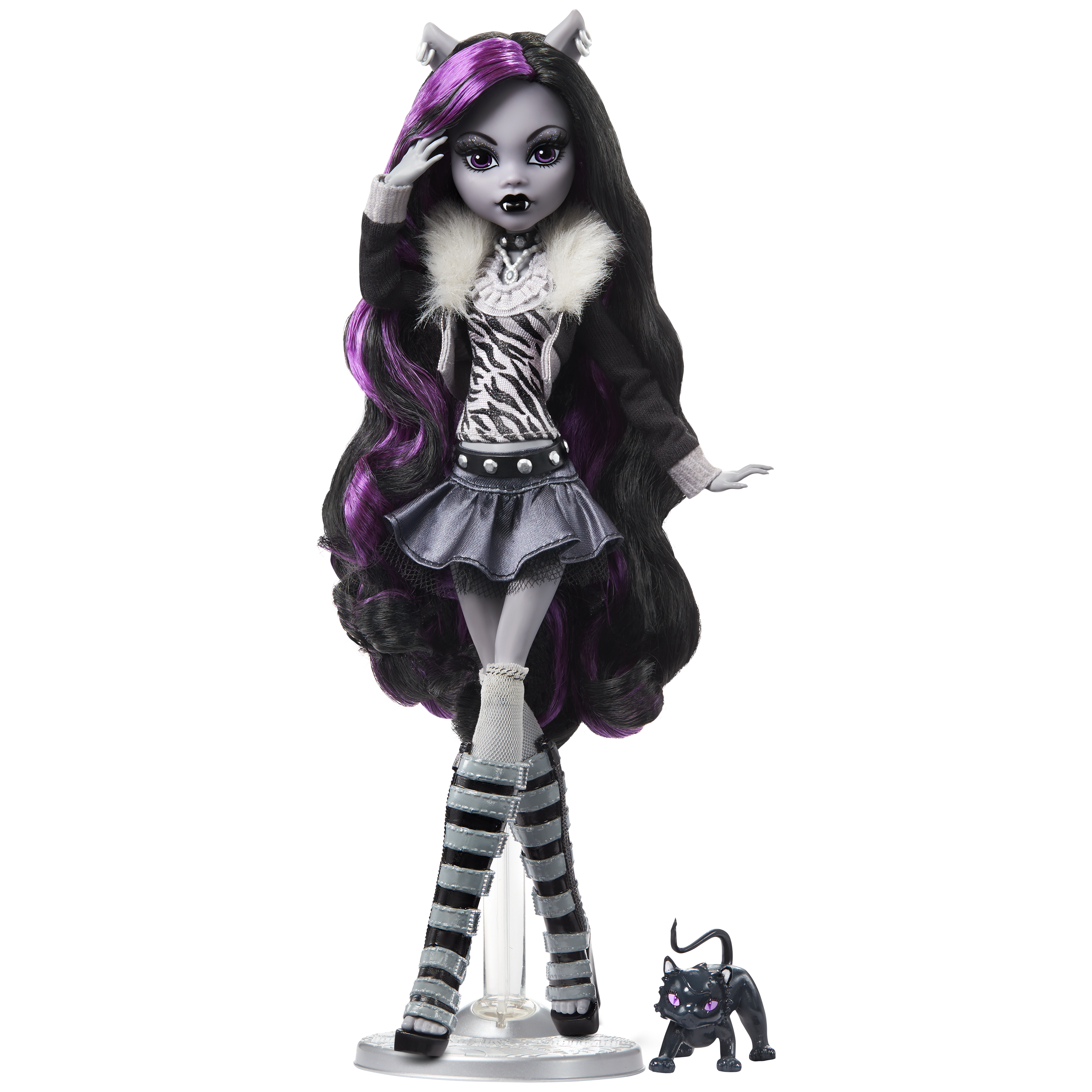Monster High doll with dark hair, purple highlights, and striped outfit on a white background
