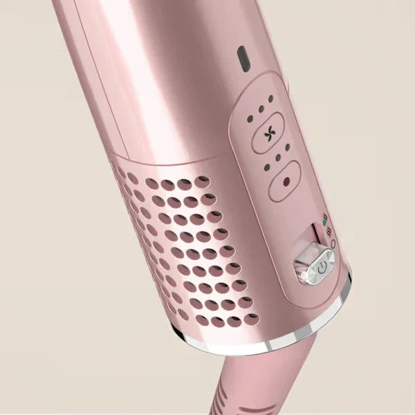 Close-up of a pink hair curler on a beige background