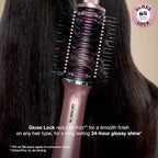 Pink hair dryer with brush attachment being used on dark hair, featuring the 'Gloss Lock' technology.
