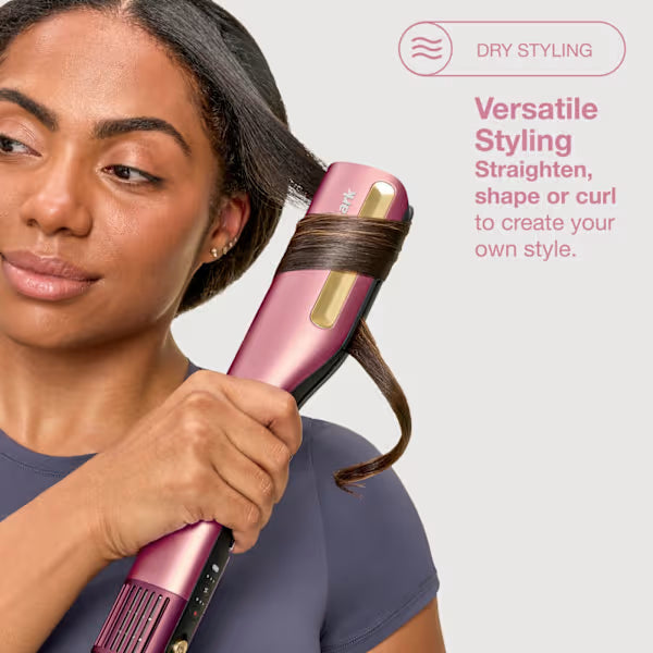 Woman using a pink hair styling tool with text about versatile styling on a white background